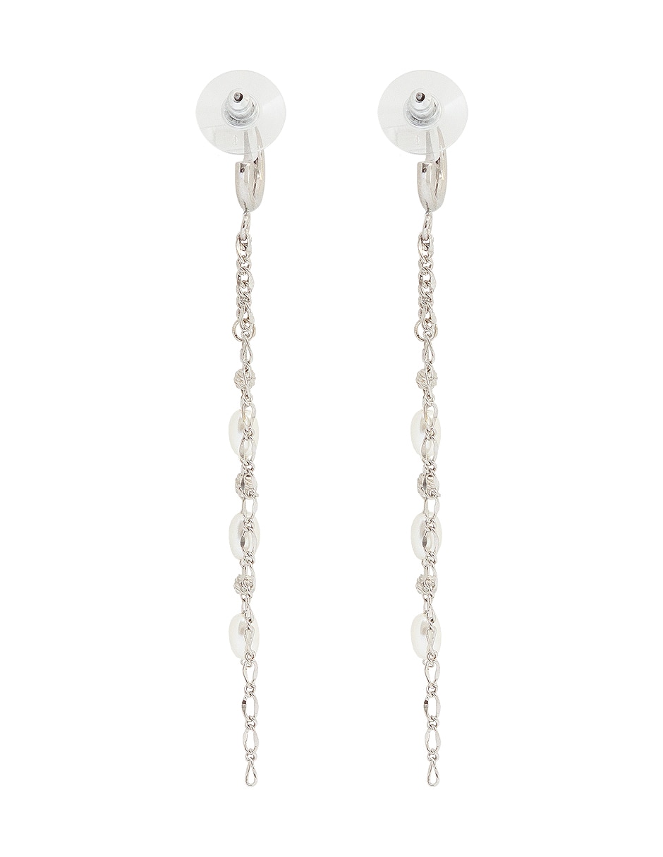 Aretes largos ovalados con acabado lustre perla 3