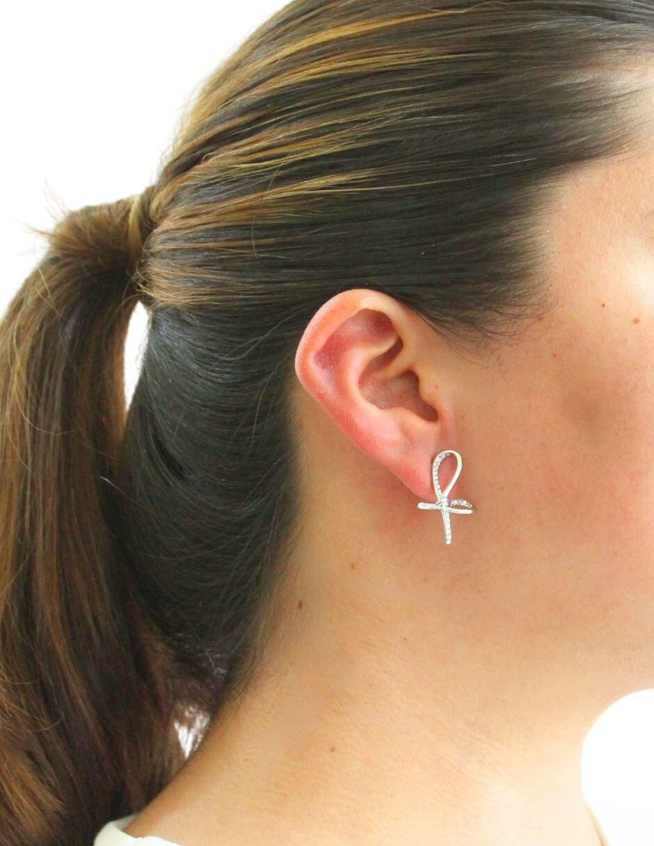 Aretes de moño con acabado brillante 5